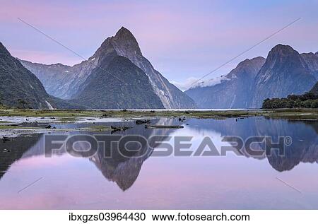 Stock Image - "Mitre Peak at dawn, Fiordland National Park, Milford Sound, South Island, New Zealand, Oceania". Fotosearch
