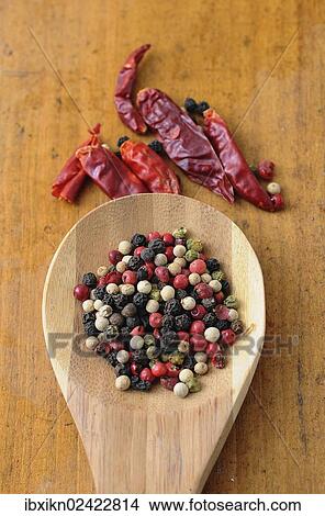 Mixed peppercorns on a wooden spoon View Large Photo Image Picture - Mixed peppercorns on a wooden spoon. Fotosearch