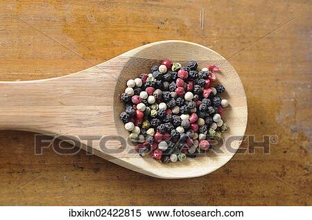 Mixed peppercorns on a wooden spoon View Large Photo Image Stock Photography - Mixed peppercorns on a wooden spoon. Fotosearch