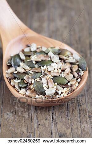 Mixed seeds on wooden spoon View Large Photo Image Stock Photo - Mixed seeds on wooden spoon. Fotosearch