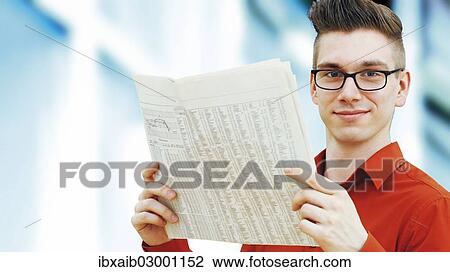 "Modern young businessman, business-punk, reading a newspaper" View Large Photo Image Stock Image - "Modern young businessman, business-punk, reading a newspaper". Fotosearch