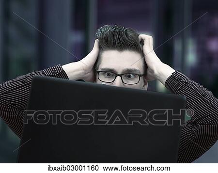 "Modern young businessman, business-punk working on a laptop, with a desperate face" View Large Photo Image Stock Image - "Modern young businessman, business-punk working on a laptop, with a desperate face". Fotosearch