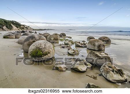 "Moeraki Boulders, geological feature, round rock balls, some fragments lying broken in ruins on the beach, Coastal Otago, Moeraki, South Island, New Zealand, Oceania" View Large Photo Image Stock Photography - "Moeraki Boulders, geological feature, round rock balls, some fragments lying broken in ruins on the beach, Coastal Otago, Moeraki, South Island, New Zealand, Oceania". Fotosearch