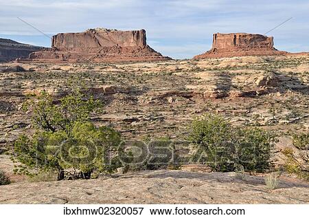 "Monitor Butte, left, and Merrimac Butte, right, Canyonlands, Moab, Utah, USA" View Large Photo Image Stock Photo - "Monitor Butte, left, and Merrimac Butte, right, Canyonlands, Moab, Utah, USA". Fotosearch