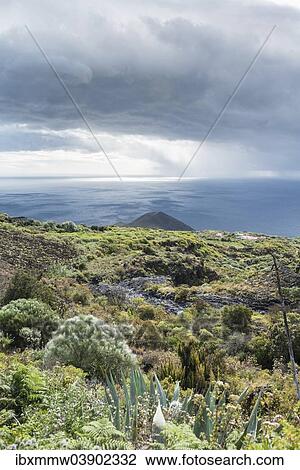 Stock Image - "Montana del Azufre, small volcano, threatening clouds, northeast of La Palma, Canary Islands, Spain, Europe". Fotosearch
