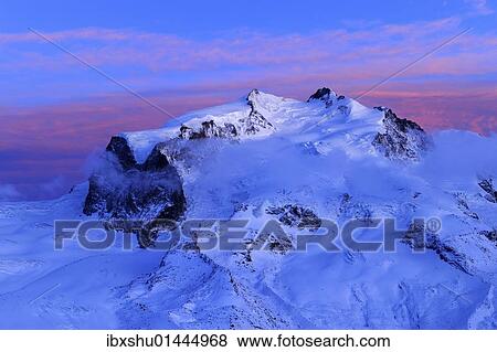 "Monte Rosa Mountains with the highest mountain in Switzerland, Pointe Dufour, red evening light, Zermatt, Valais, Switzerland, Europe" View Large Photo Image Stock Photo - "Monte Rosa Mountains with the highest mountain in Switzerland, Pointe Dufour, red evening light, Zermatt, Valais, Switzerland, Europe". Fotosearch