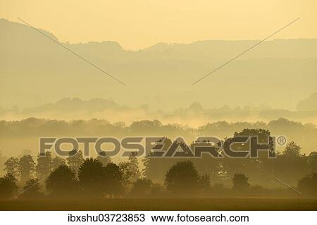 Stock Image - "Morning fog atmosphere in Reuss Valley, Aristau, Canton of Aargau, Switzerland, Europe". Fotosearch