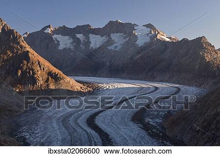 Stock Image - "Morning light on the Aletsch Glacier, seen from Moosfluh Mountain near Riederalp, Valais, Swiss Alps, Switzerland, Europe, PublicGround, Europe". Fotosearch