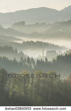 "Morning mist over wooded hills, Eichberg-Trautenburg, Styria, Austria, Europe" View Large Photo Image Stock Image - "Morning mist over wooded hills, Eichberg-Trautenburg, Styria, Austria, Europe". Fotosearch