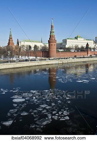 Stock Image - "Moscow Kremlin with palace and cathedrals in spring, Moskva River, reflections, ice floes on the water, Moscow, Russia, Europe". Fotosearch