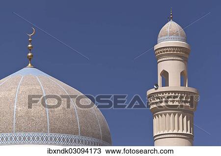 Stock Image - "Mosque with a golden crescent moon and a minaret, Bahla, Ad Dakhiliyah, Oman, Asia". Fotosearch