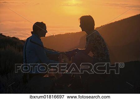 "Mother and child at sunset in the Teide National Park overlooking a sea of clouds in front of La Palma, Tenerife, Canary Islands, Spain, Europe" View Large Photo Image Stock Photo - "Mother and child at sunset in the Teide National Park overlooking a sea of clouds in front of La Palma, Tenerife, Canary Islands, Spain, Europe". Fotosearch