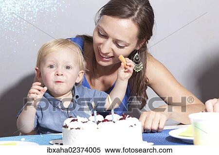 Mother and child at the child's birthday party View Large Photo Image Stock Photography - Mother and child at the child's birthday party. Fotosearch