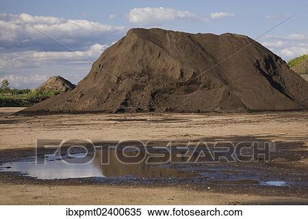 "Mound of topsoil in a commercial sandpit after a heavy rainfall, Quebec, Canada, North America" View Large Photo Image Stock Photography - "Mound of topsoil in a commercial sandpit after a heavy rainfall, Quebec, Canada, North America". Fotosearch