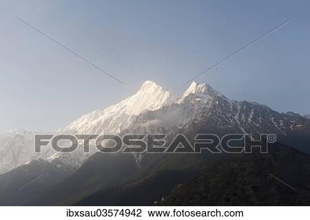 "Mount Nilgiri North, 7061 m, in the morning light, bei Jomsom, Lower Mustang, Nepal, Asia" View Large Photo Image Stock Image - "Mount Nilgiri North, 7061 m, in the morning light, bei Jomsom, Lower Mustang, Nepal, Asia". Fotosearch