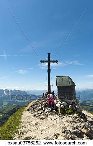 "Mountain climber at the summit cross with a small chapel on Geigelstein Mountain, 1808 m, Geigelstein Nature Reserve, Aschau im Chiemgau, Upper Bavaria, Bavaria, Germany, Europe" View Large Photo Image Stock Image - "Mountain climber at the summit cross with a small chapel on Geigelstein Mountain, 1808 m, Geigelstein Nature Reserve, Aschau im Chiemgau, Upper Bavaria, Bavaria, Germany, Europe". Fotosearch
