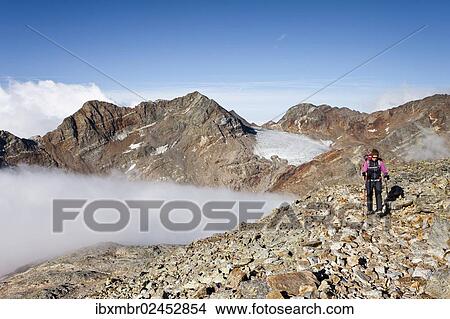 "Mountain climber during the ascent of Fernerkoepfl Mountain in the Rieserferner Group in the Puster Valley, Alto Adige, Italy, Europe" View Large Photo Image Picture - "Mountain climber during the ascent of Fernerkoepfl Mountain in the Rieserferner Group in the Puster Valley, Alto Adige, Italy, Europe". Fotosearch