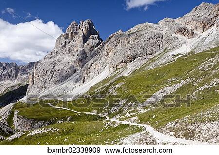 Stock Photo - "Mountain climbers during the ascent to Kesselkogel Mountain above the Rifugio Preuss and Rifugio Vaiolet huts in the Rosengarten Group, with the Rosengarten Group at the rear, Trentino, Italy, Europe". Fotosearch