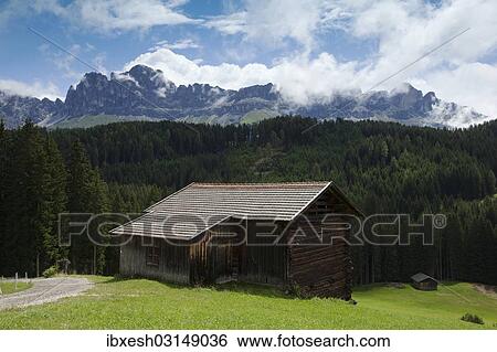 Stock Photograph - "Mountain hut with Latemar Mountain, Karerpass mountain pass, Dolomites, Karerpass, South Tyrol province, Trentino-Alto Adige, Italy, Europe". Fotosearch
