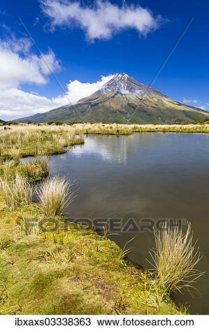 "Mountain lake with the Mount Taranaki volcano, Pouakai Range, Egmont National Park, Taranaki Region, New Caledonia, New Zealand, Oceania" View Large Photo Image Stock Image - "Mountain lake with the Mount Taranaki volcano, Pouakai Range, Egmont National Park, Taranaki Region, New Caledonia, New Zealand, Oceania". Fotosearch