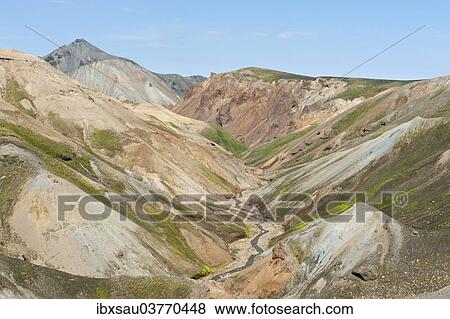 "Mountain landscape, colourful rhyolite rock, partly overgrown with moss, Blahnjukur Volcano at the rear, Landmannalaugar, Highlands, Suourland, Iceland, Europe" View Large Photo Image Stock Photo - "Mountain landscape, colourful rhyolite rock, partly overgrown with moss, Blahnjukur Volcano at the rear, Landmannalaugar, Highlands, Suourland, Iceland, Europe". Fotosearch