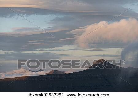 "Mountain landscape in the evening light with a cloudy sky, Slaettaratindur, Eysturoy, Faroe Islands, Denmark, Europe" View Large Photo Image Stock Image - "Mountain landscape in the evening light with a cloudy sky, Slaettaratindur, Eysturoy, Faroe Islands, Denmark, Europe". Fotosearch