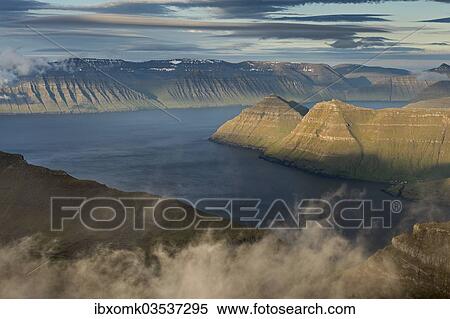 "Mountain landscape in the evening light, islands of Kalsoy and Kunoy at the rear, Slaettaratindur, Eysturoy, Faroe Islands, Denmark, Europe" View Large Photo Image Stock Photography - "Mountain landscape in the evening light, islands of Kalsoy and Kunoy at the rear, Slaettaratindur, Eysturoy, Faroe Islands, Denmark, Europe". Fotosearch