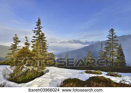 "Mountain landscape with snow, at the back the Inn Valley and at the far back the Karwendel Range, from Mt Kleiner Gamsstein, Tux Prealps, Tyrol, Austria, Europe" View Large Photo Image Picture - "Mountain landscape with snow, at the back the Inn Valley and at the far back the Karwendel Range, from Mt Kleiner Gamsstein, Tux Prealps, Tyrol, Austria, Europe". Fotosearch