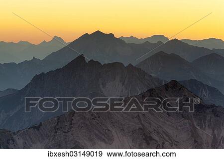 "Mountain ridges at sunset from Mount Hochiss in the Rofan massif, Rofan, Tyrol, Austria, Brandenberg Alps, Rofan, Tyrol, Austria, Europe" View Large Photo Image Stock Photo - "Mountain ridges at sunset from Mount Hochiss in the Rofan massif, Rofan, Tyrol, Austria, Brandenberg Alps, Rofan, Tyrol, Austria, Europe". Fotosearch