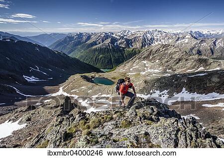 "Mountaineer during the ascent of Mt Grawand, Ortler Alps at the back, Val Senales below with the Vernagt Reservoir, Meraner Land area, Merano, Meran region, South Tyrol, Italy, Europe" View Large Photo Image Stock Photograph - "Mountaineer during the ascent of Mt Grawand, Ortler Alps at the back, Val Senales below with the Vernagt Reservoir, Meraner Land area, Merano, Meran region, South Tyrol, Italy, Europe". Fotosearch