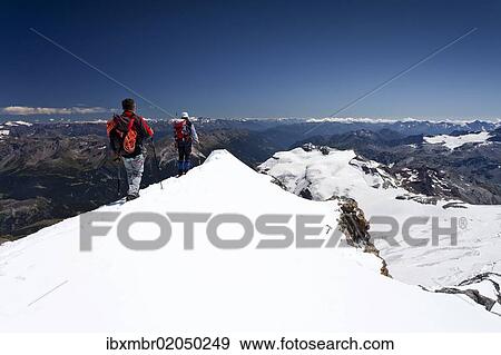 "Mountaineer on the summit ridge, descent from Mt Piz Palue, Grisons, Switzerland, Europe" View Large Photo Image Stock Photo - "Mountaineer on the summit ridge, descent from Mt Piz Palue, Grisons, Switzerland, Europe". Fotosearch