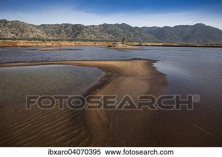 "Mountainous coastal landscape near Ca Na, in the foreground an artificial lake for salt production, Ninh Thuan, Vietnam, Asia" View Large Photo Image Stock Photography - "Mountainous coastal landscape near Ca Na, in the foreground an artificial lake for salt production, Ninh Thuan, Vietnam, Asia". Fotosearch