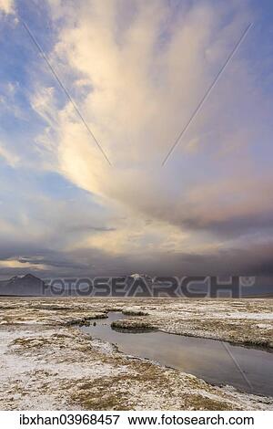 "Mountains and clouds in the evening light, at the salt lake Salar de Surire, Putre, Arica y Parinacota Region, Chile, South America" View Large Photo Image Stock Photo - "Mountains and clouds in the evening light, at the salt lake Salar de Surire, Putre, Arica y Parinacota Region, Chile, South America". Fotosearch