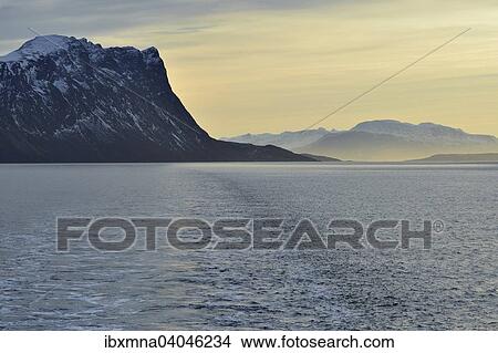 Picture - "Mountains of Grytoya island in the morning light, Grytoya island, Toppsund, Troms, Norway, Europe". Fotosearch