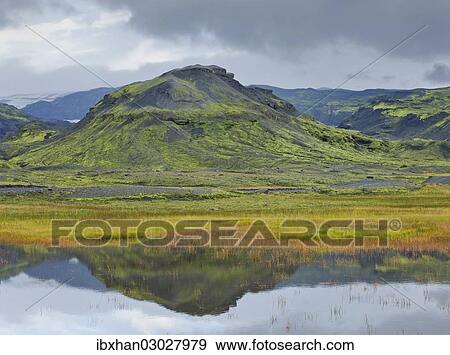"Mountains reflected in a small lake near Soelheimajoekulsvegur, Iceland, Europe" View Large Photo Image Stock Photo - "Mountains reflected in a small lake near Soelheimajoekulsvegur, Iceland, Europe". Fotosearch