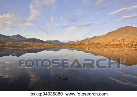"Mountains reflected in Lake Doralstjornin or Doralstjornin, Rondane National Park, Norway, Europe" View Large Photo Image Stock Image - "Mountains reflected in Lake Doralstjornin or Doralstjornin, Rondane National Park, Norway, Europe". Fotosearch