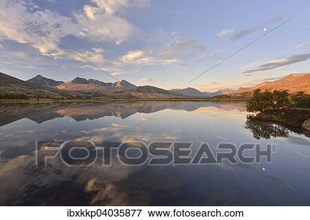 "Mountains reflected in Lake Doralstjornin or Doralstjornin, Rondane National Park, Norway, Europe" View Large Photo Image Stock Photo - "Mountains reflected in Lake Doralstjornin or Doralstjornin, Rondane National Park, Norway, Europe". Fotosearch