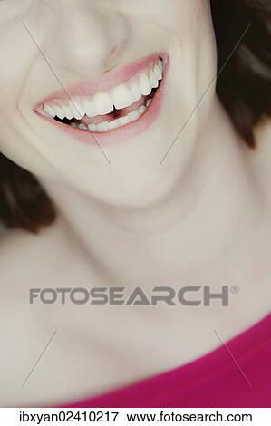 Stock Photo - "Mouth of a smiling young woman, detail". Fotosearch