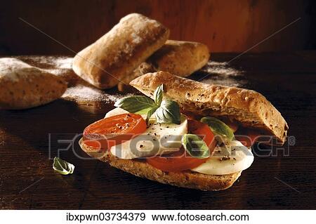 Mozzarella and tomato sandwich View Large Photo Image Stock Photo - Mozzarella and tomato sandwich. Fotosearch