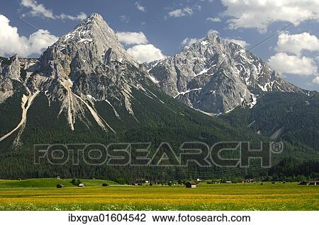 Stock Image - "Mt. Ehrwalder Sonnenspitze and Mt. Gruenstein, Ehrwald, Mieminger Kette range, Tyrol, Austria, Europe". Fotosearch