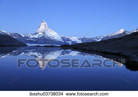 "Mt Matterhorn reflected in Stellisee Lake at dusk, Zermatt, Canton of Valais, Switzerland, Europe" View Large Photo Image Picture - "Mt Matterhorn reflected in Stellisee Lake at dusk, Zermatt, Canton of Valais, Switzerland, Europe". Fotosearch