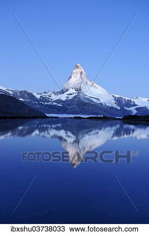 "Mt Matterhorn reflected in Stellisee Lake at dusk, Zermatt, Canton of Valais, Switzerland, Europe" View Large Photo Image Stock Image - "Mt Matterhorn reflected in Stellisee Lake at dusk, Zermatt, Canton of Valais, Switzerland, Europe". Fotosearch