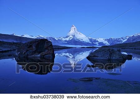 "Mt Matterhorn reflected in Stellisee Lake at dusk, Zermatt, Canton of Valais, Switzerland, Europe" View Large Photo Image Stock Photo - "Mt Matterhorn reflected in Stellisee Lake at dusk, Zermatt, Canton of Valais, Switzerland, Europe". Fotosearch