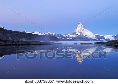 "Mt Matterhorn reflected in Stellisee Lake at dusk, Zermatt, Canton of Valais, Switzerland, Europe" View Large Photo Image Stock Photo - "Mt Matterhorn reflected in Stellisee Lake at dusk, Zermatt, Canton of Valais, Switzerland, Europe". Fotosearch