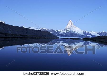 "Mt Matterhorn reflected in Stellisee Lake at dusk, Zermatt, Canton of Valais, Switzerland, Europe" View Large Photo Image Stock Photograph - "Mt Matterhorn reflected in Stellisee Lake at dusk, Zermatt, Canton of Valais, Switzerland, Europe". Fotosearch