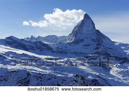 Stock Photography - "Mt. Matterhorn with a cloud flag in Zermatt, Valais, Switzerland, Europe". Fotosearch