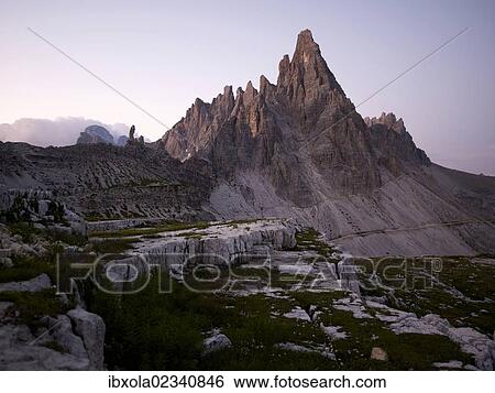 Stock Photograph - "Mt Paternkofel at dawn, Sexten Dolomites, Dolomiti di Sesto National Park, Hochpustertal, High Puster Valley, South Tyrol, Italy, Europe". Fotosearch