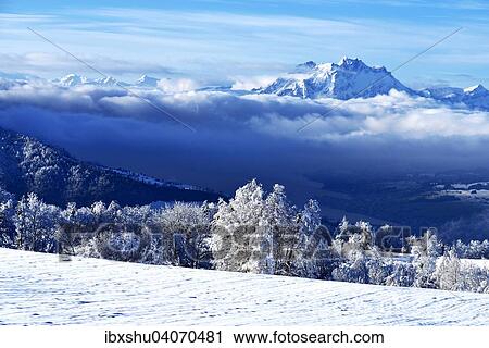 Stock Image - "Mt. Pilatus in winter landscape with Lake Zug in the foreground, Zugerberg, Canton of train, Switzerland, Europe". Fotosearch