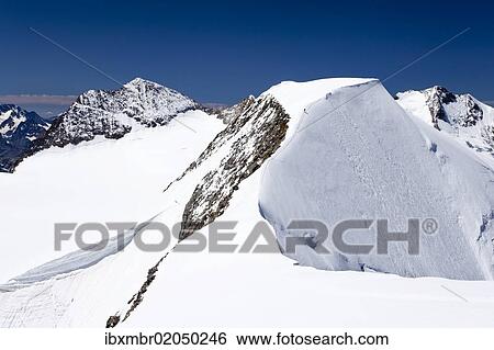 "Mt Piz Palue, summit ridge, summit of Mt Piz Bernina with Biancograt ridge at back, Grisons, Switzerland, Europe" View Large Photo Image Stock Photograph - "Mt Piz Palue, summit ridge, summit of Mt Piz Bernina with Biancograt ridge at back, Grisons, Switzerland, Europe". Fotosearch