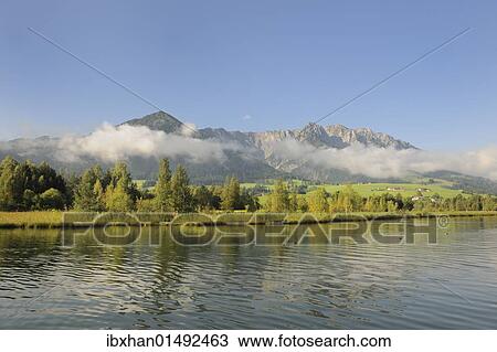 "Mt Zahmer Kaiser and Walchsee Lake seen from Camping Seespitz, Tyrol, Austria, Europe" View Large Photo Image Stock Image - "Mt Zahmer Kaiser and Walchsee Lake seen from Camping Seespitz, Tyrol, Austria, Europe". Fotosearch